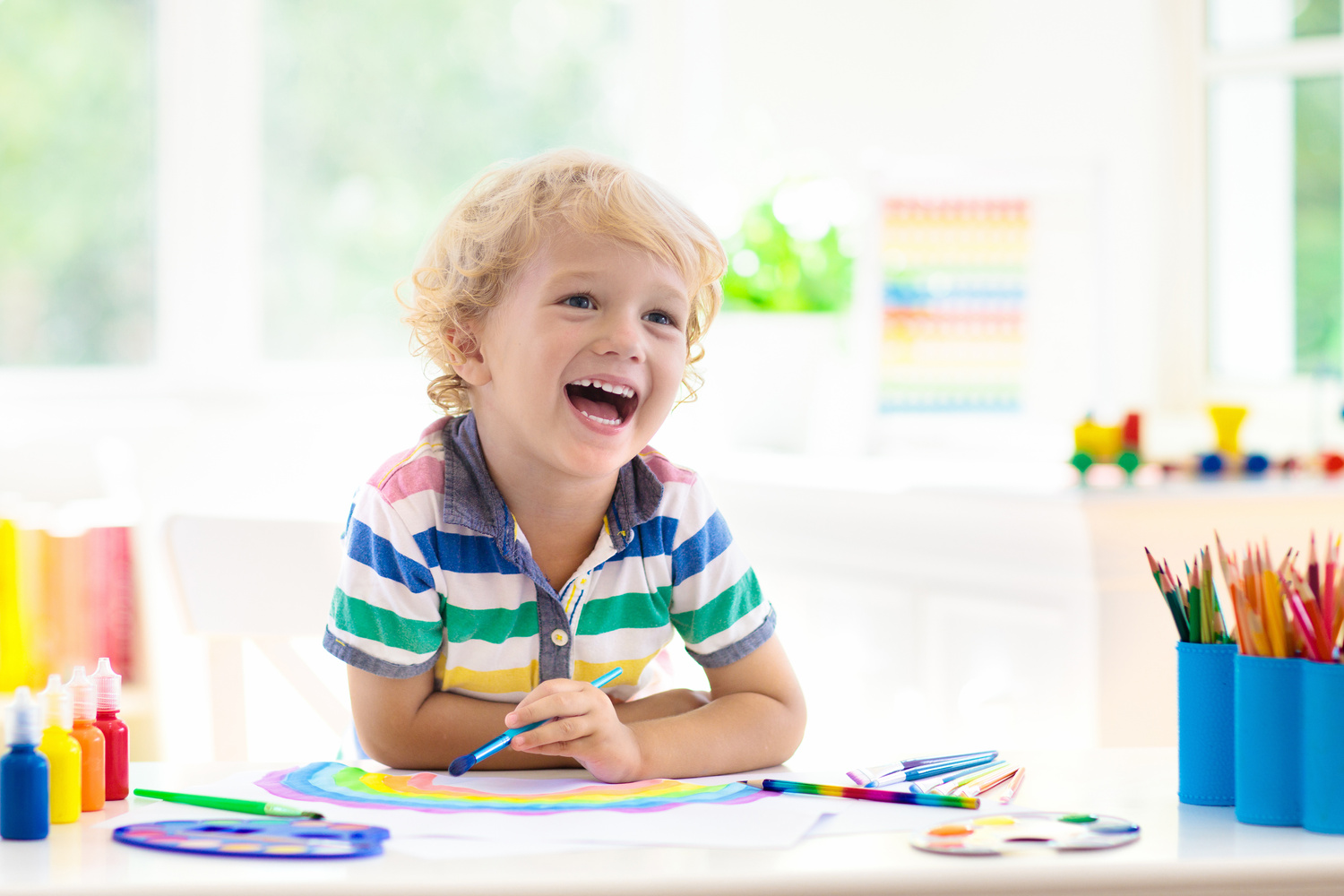 Kids paint. Child painting. Little boy drawing.