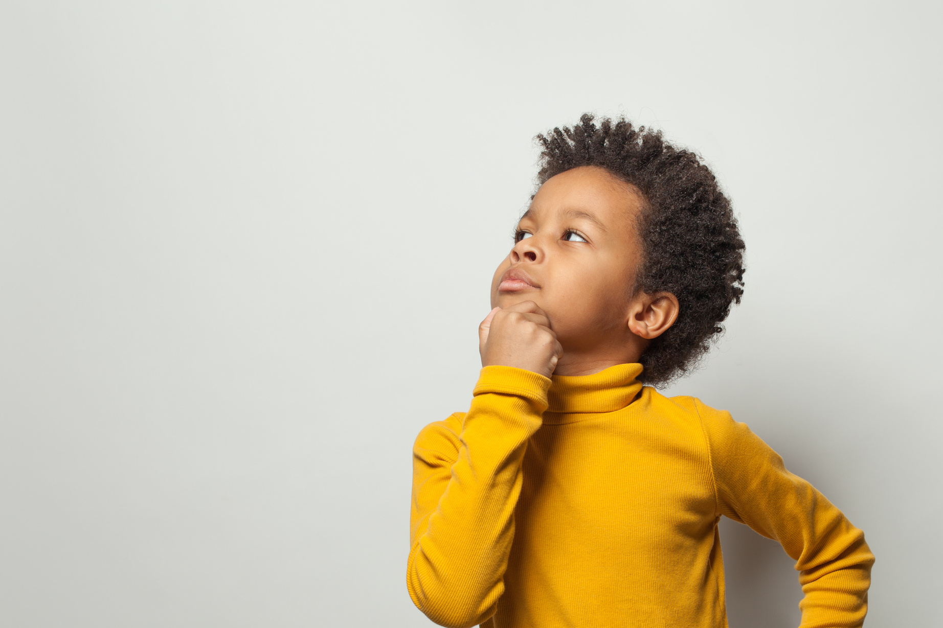 Smart schoolboy black kid boy thinking on white background